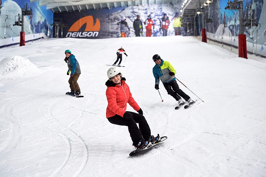 Skiers and Snowboard on the Main Slope at The Snow Centre