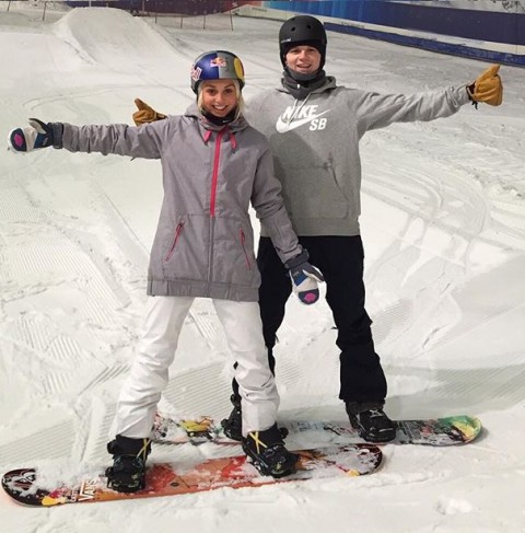 Aimee Fuller and Jamie Nicholls posing for a photo on the snow at The Snow Centre