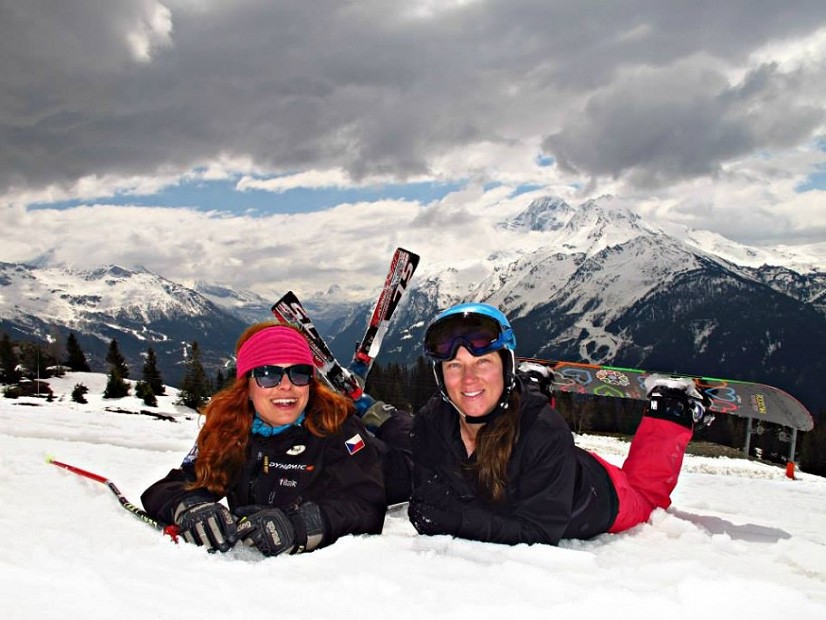 Two boarders lying on the snow