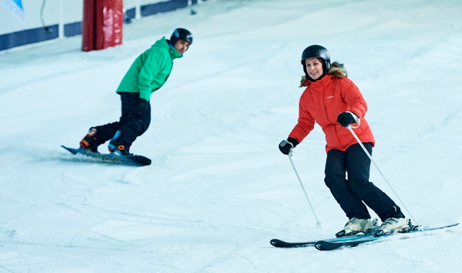 Ski and snowboarder on an indoor slope near London