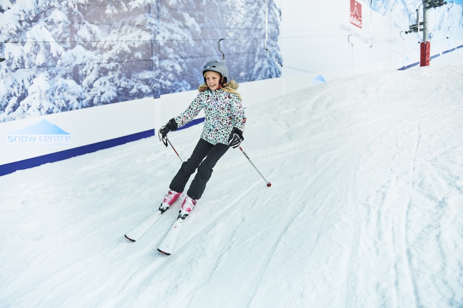 teenage girl skiing