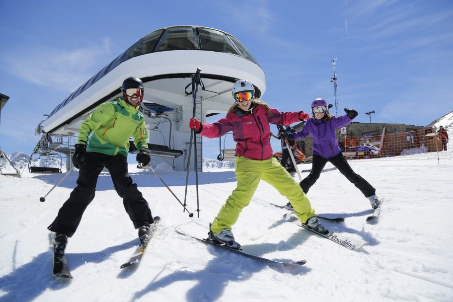 Family having fun on a snowy mountain