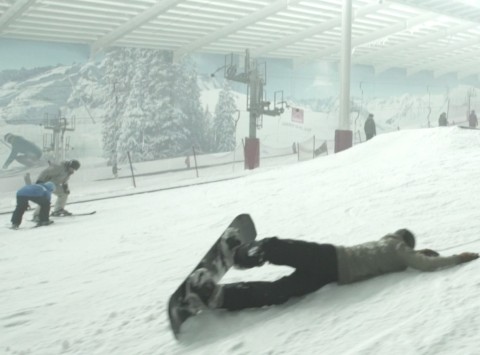 Snowboarder lying on the snow