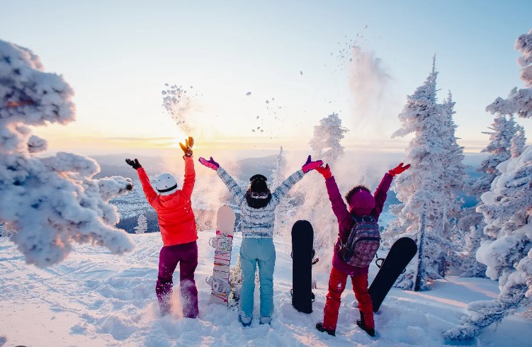 3 people enjoying the snow