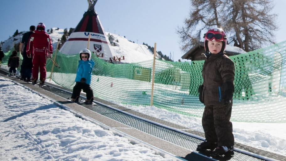 Young children in Switzerland ski resort