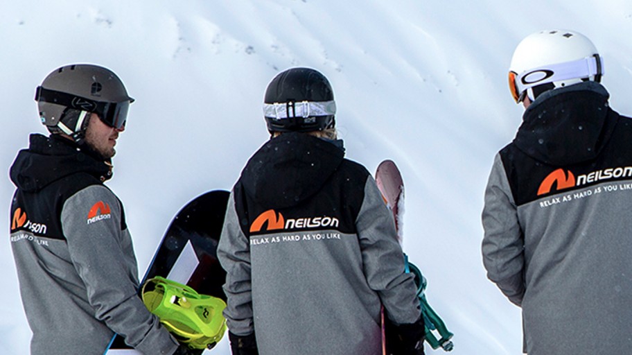 Neilson Mountain Experts at the top of a mountain