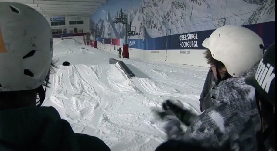 Juniors wearing helmets looking onto an indoor slope near London