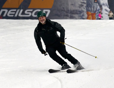 Man Skiing on The Snow Centre Main Slope