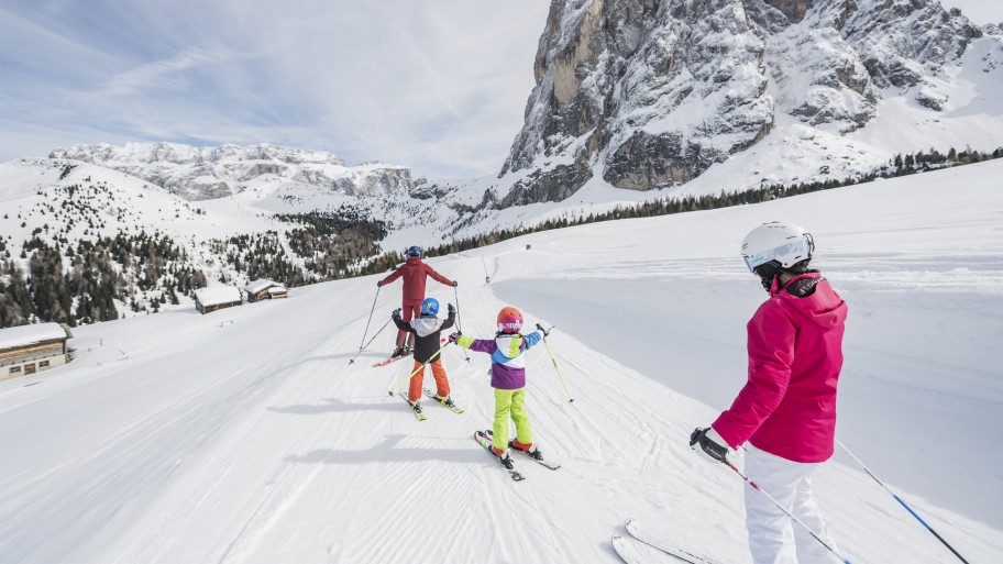 Family skiing in a resort