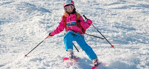Young Girl Skiing Moguls
